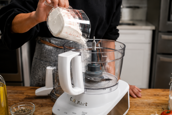 close up of chef using food processor